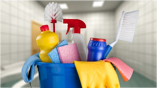Harrow Cleaner staff using PPE during a cleaning task