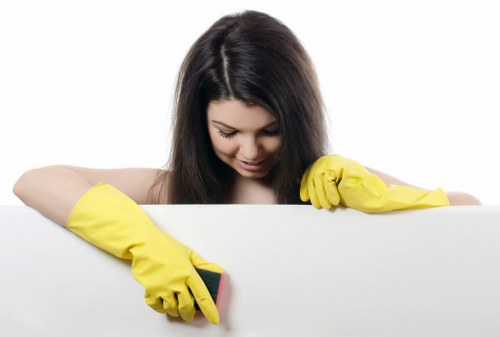 Team member preparing cleaning tools and protective gear safely