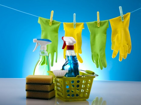 Cleaning staff using protective gloves and apron